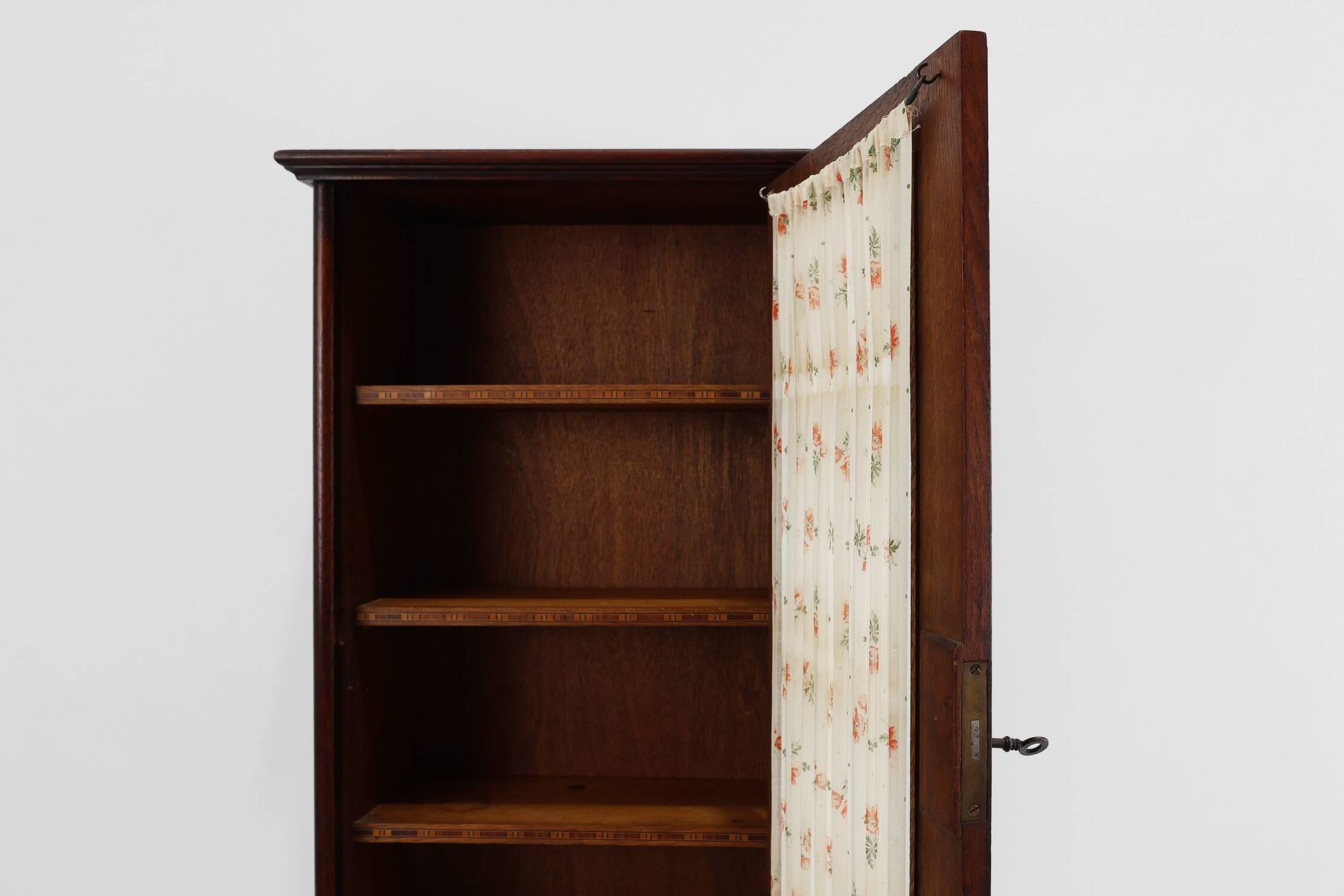 French Art Deco tall cabinet with glass door and hidden compartiment, ca. 1