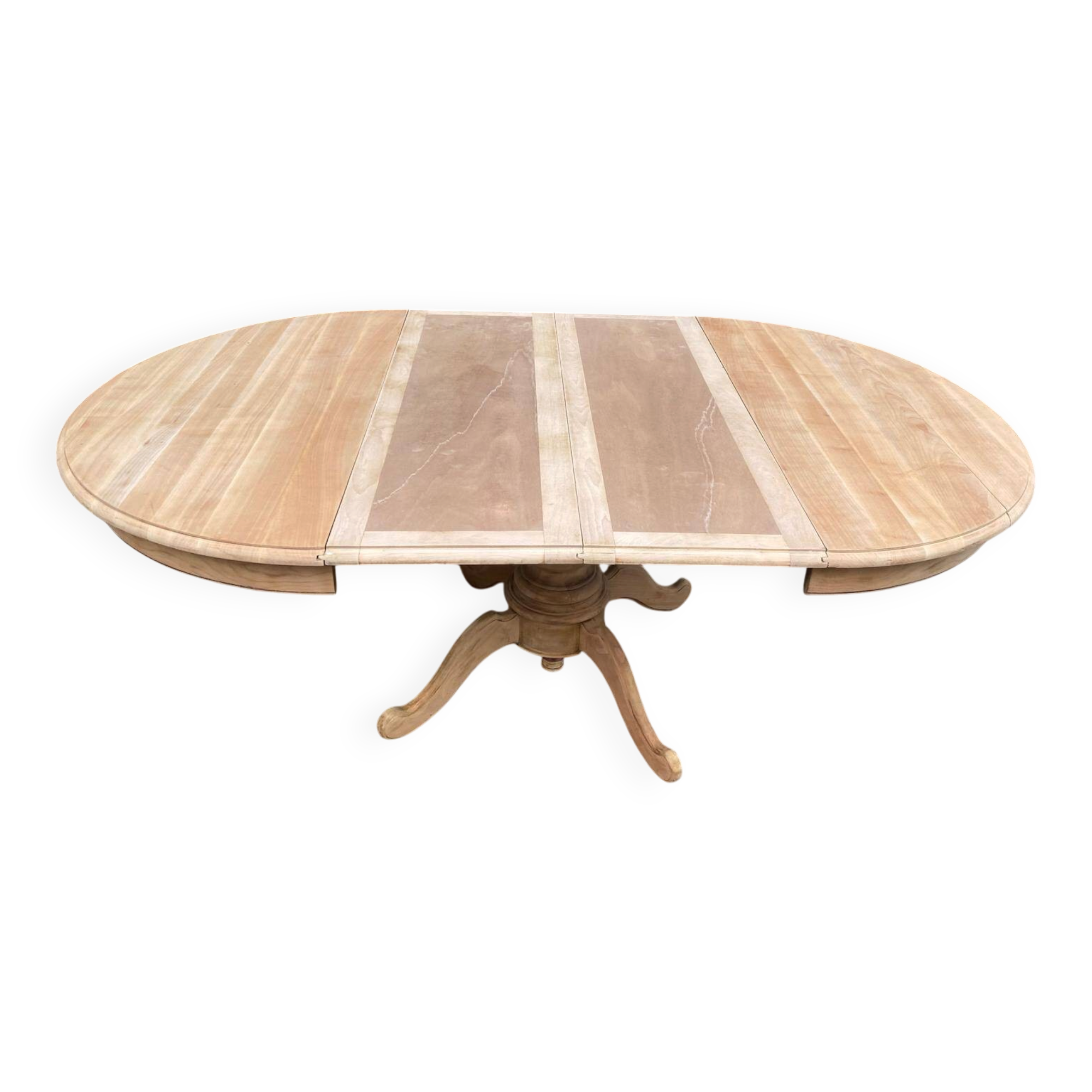 Round dining table with a central pedestal, extendable, stripped in solid walnut with 2 extensions.