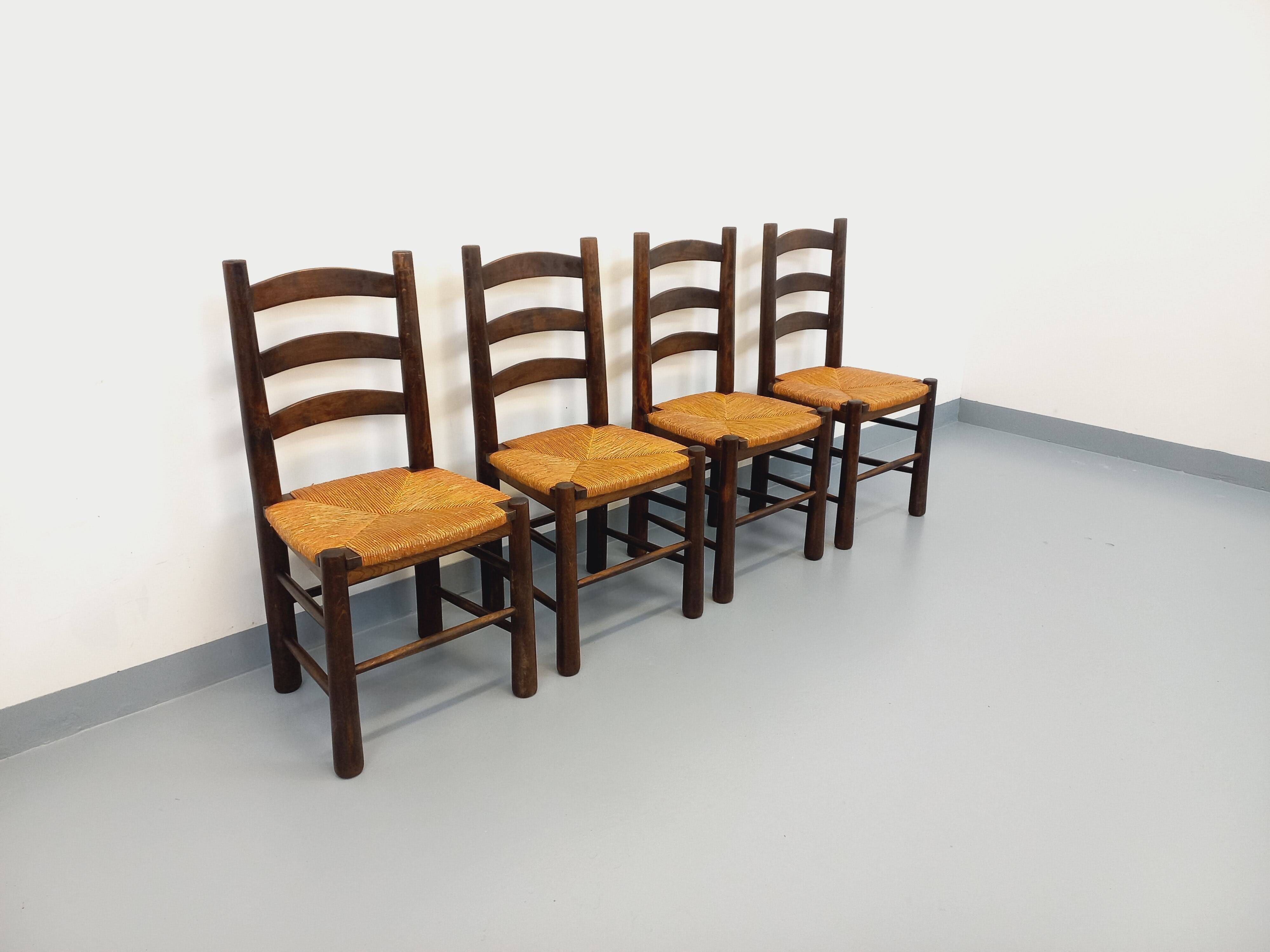 Set of 4 vintage brutalist chairs by Georges Robert in wood and straw.