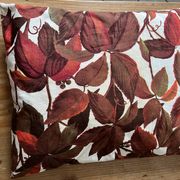 Vintage cushion with virgin vine leaf pattern.