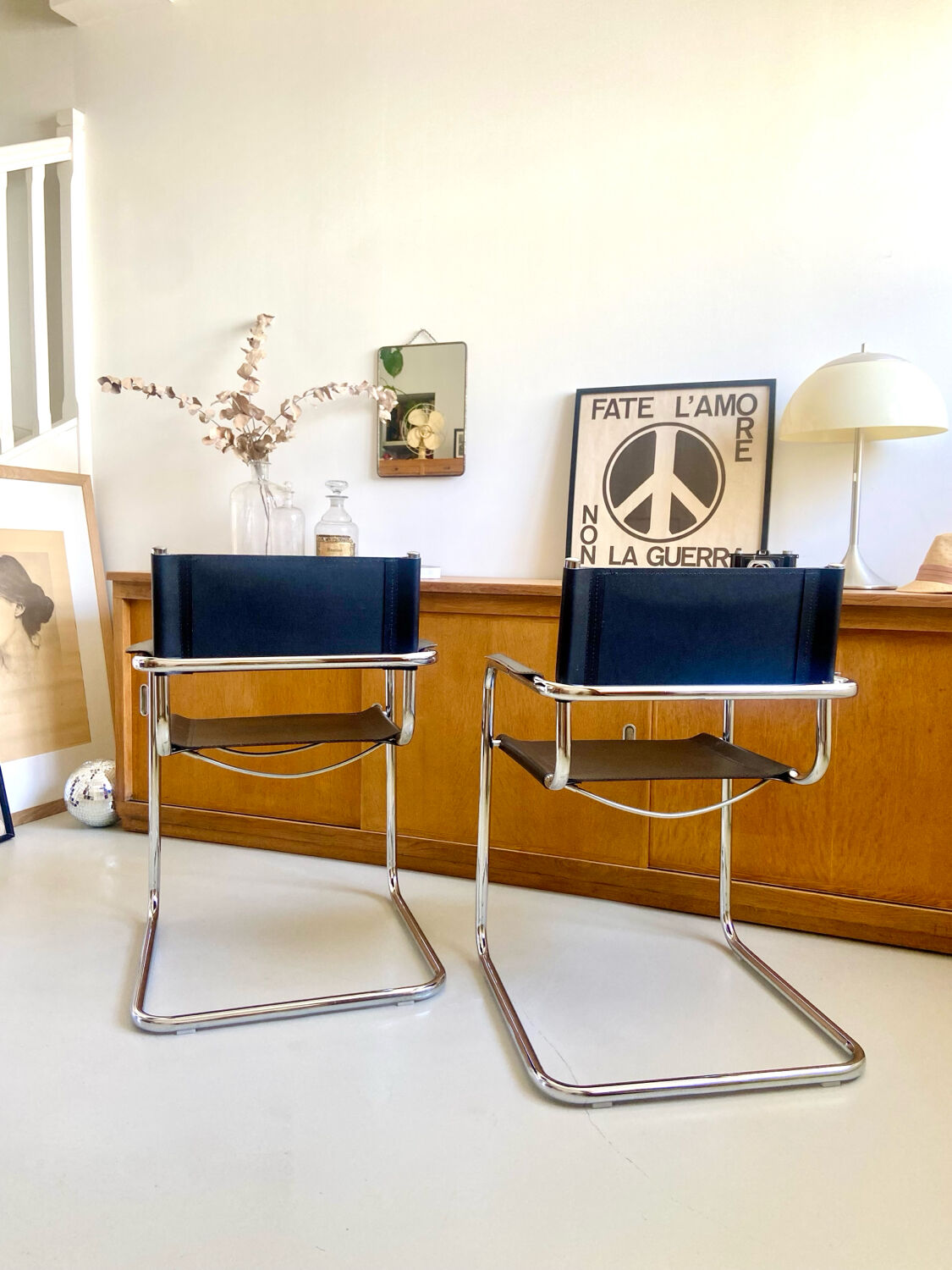 Pair of vintage chrome and black faux leather armchairs