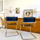Pair of vintage chrome and black faux leather armchairs