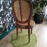 Wooden chair sitting in cannage