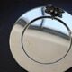 Vintage silver-plated round service tray with embossed cherries.
