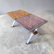 Vintage chrome coffee table with ceramic accent.