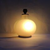 Vintage frosted glass lamp, round globe, elegant design, soft light.