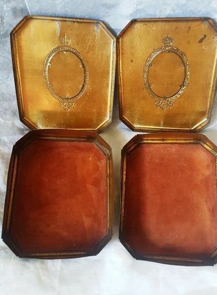 Ancient metal chocolate boxes with royal portraits