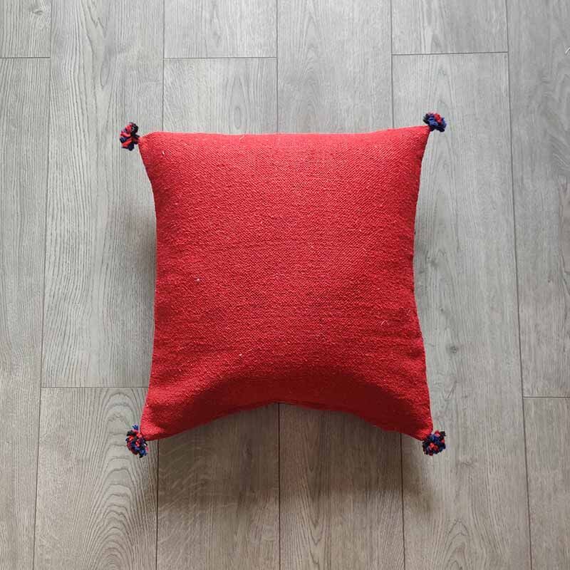Red Berber cushion with cotton pompom