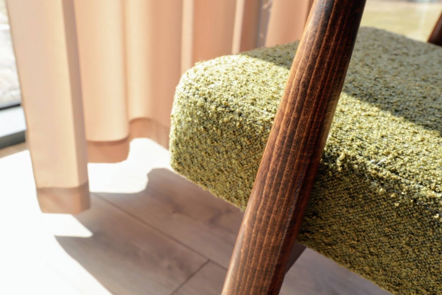 Mid-century modern armchair in olive green bouclé design by H. Lis.