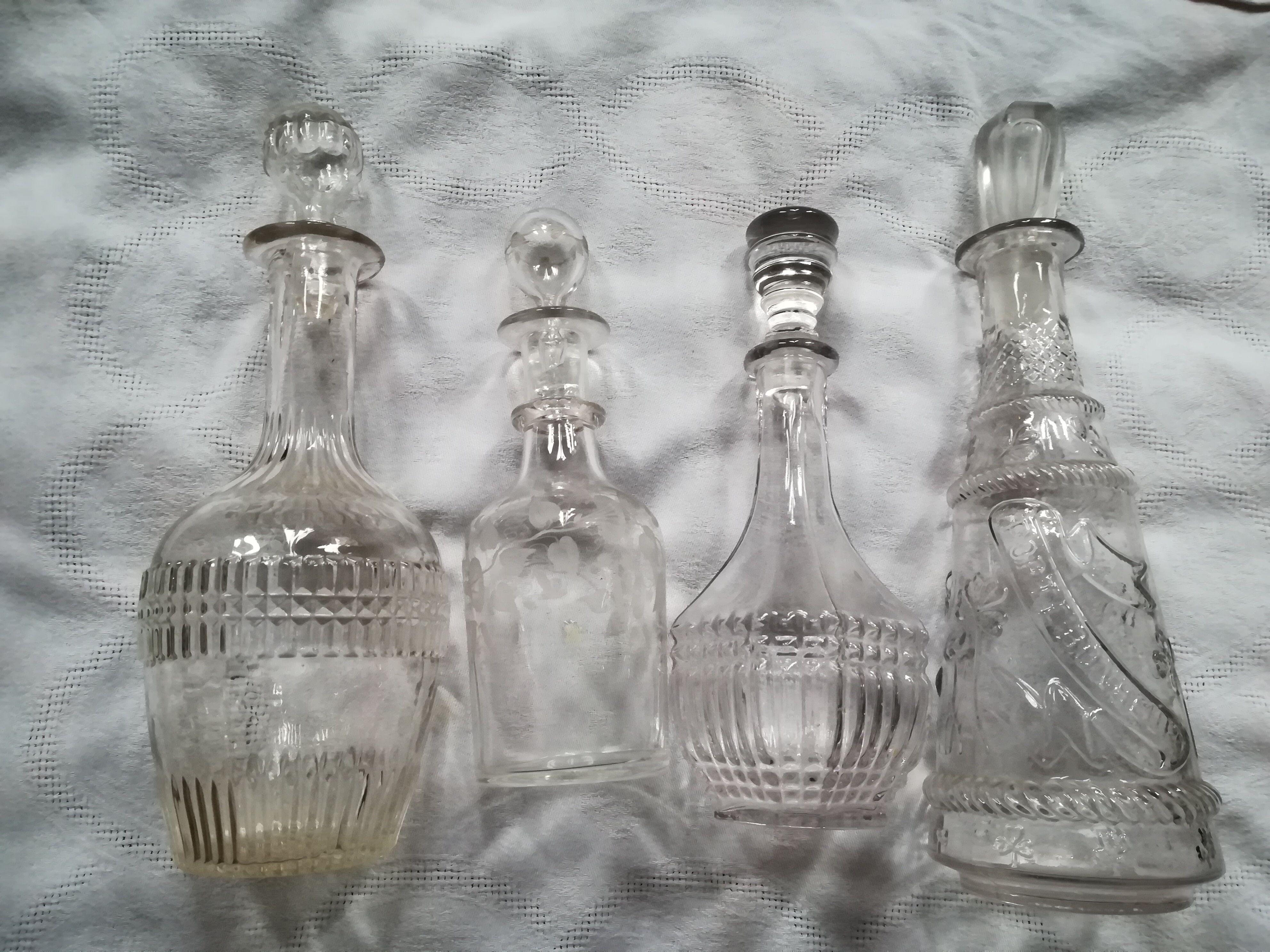 Set of four glass carafes