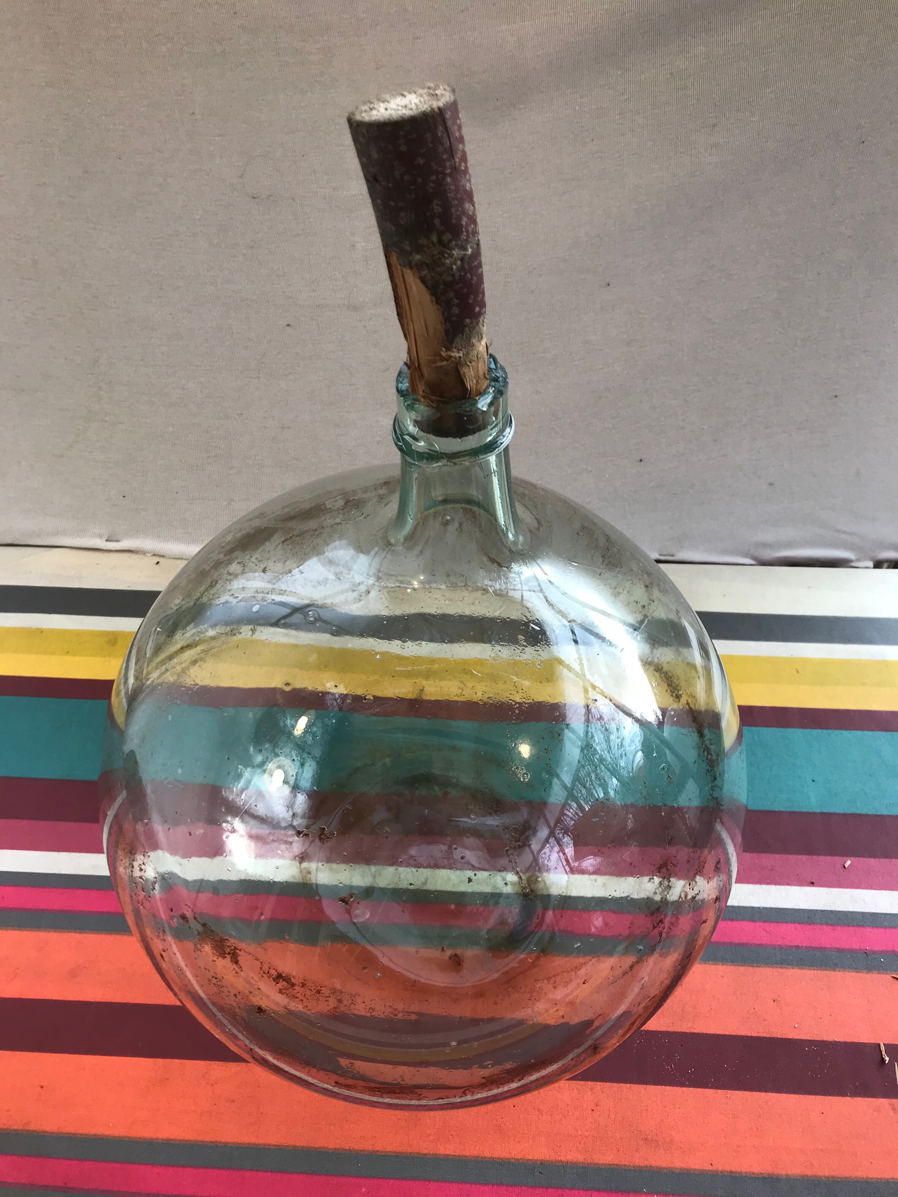 Former green glass demijohn