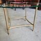 Table basse plateau verre rond et pieds laiton