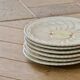 Vintage earthenware plates with a trompe l'oeil apple tart design