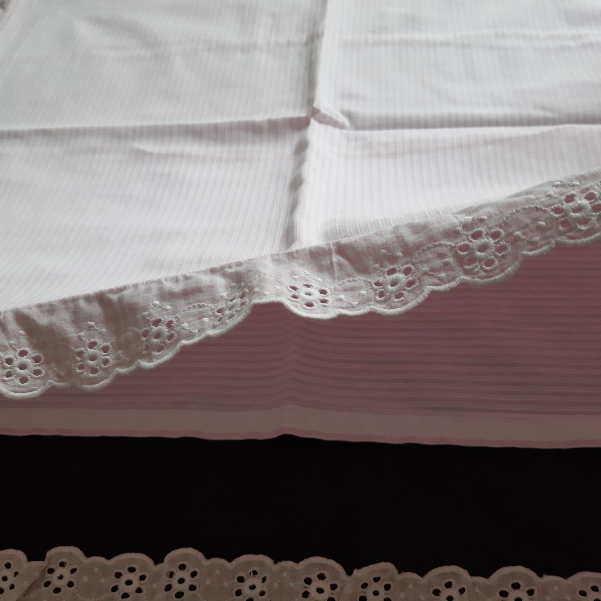 Old baby bed linen adornment