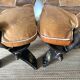 Pair of low Egyptian stools, camel saddles in wood, leather and brass
