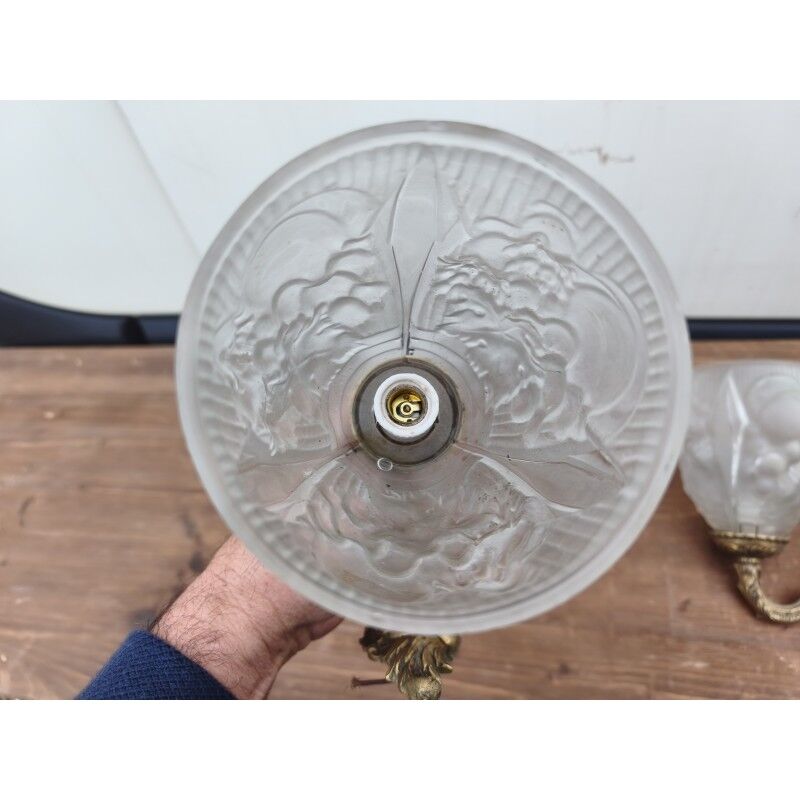 Pair of brass wall lights and glass paste.