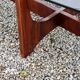 Designer coffee table by Hugues Poignant in rosewood and smoked glass from the 70s