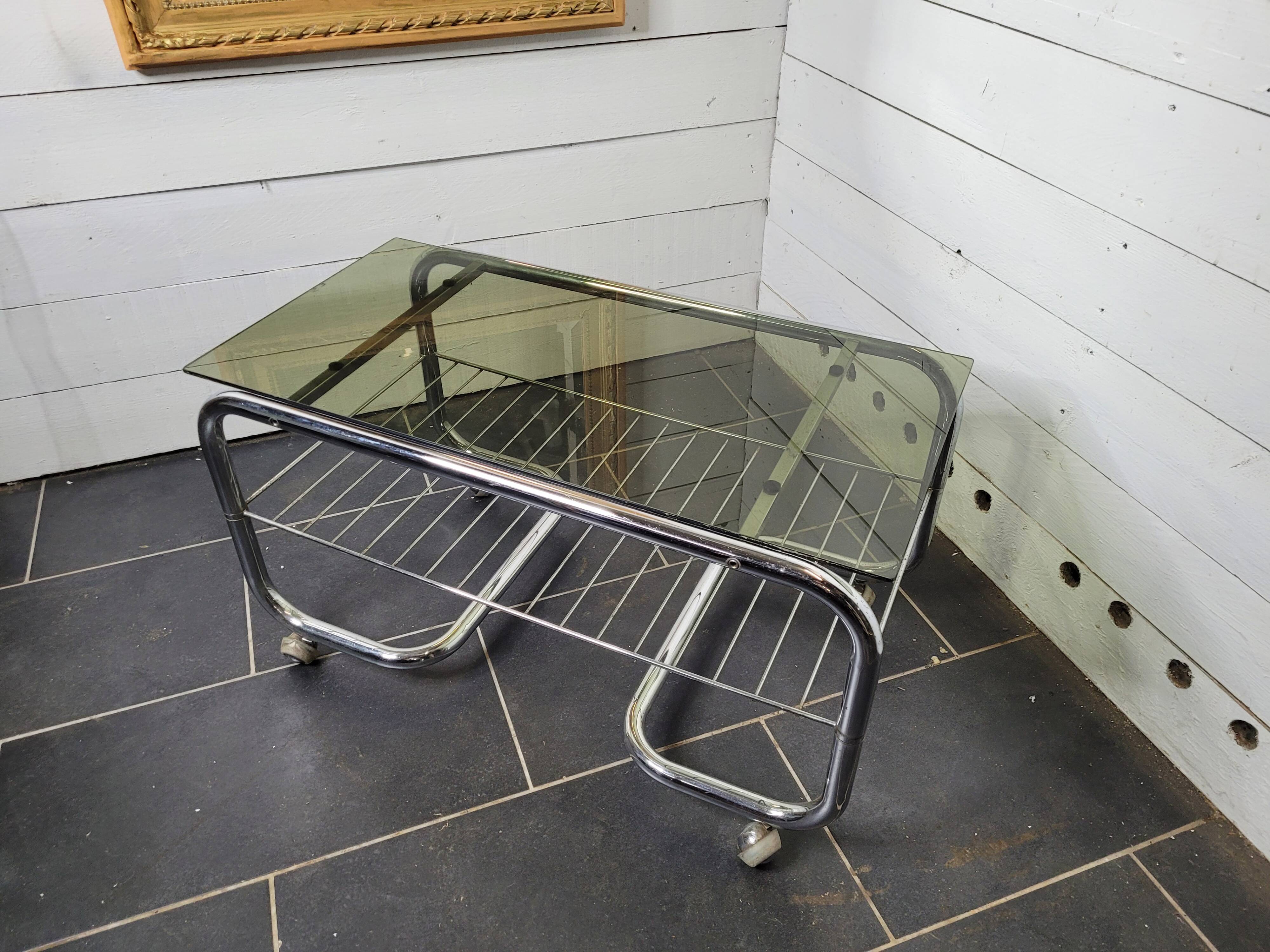 Coffee table with chrome base and smoked glass from the 70s