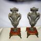 2 ancient amphorae in regulation on marble base