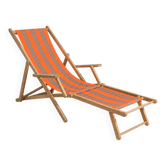 Vintage deck chair with orange and grey striped fabric, original patina.