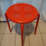 Red patinated metal stool