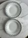 Set of two green frilled deep plates from Saint-Amand.