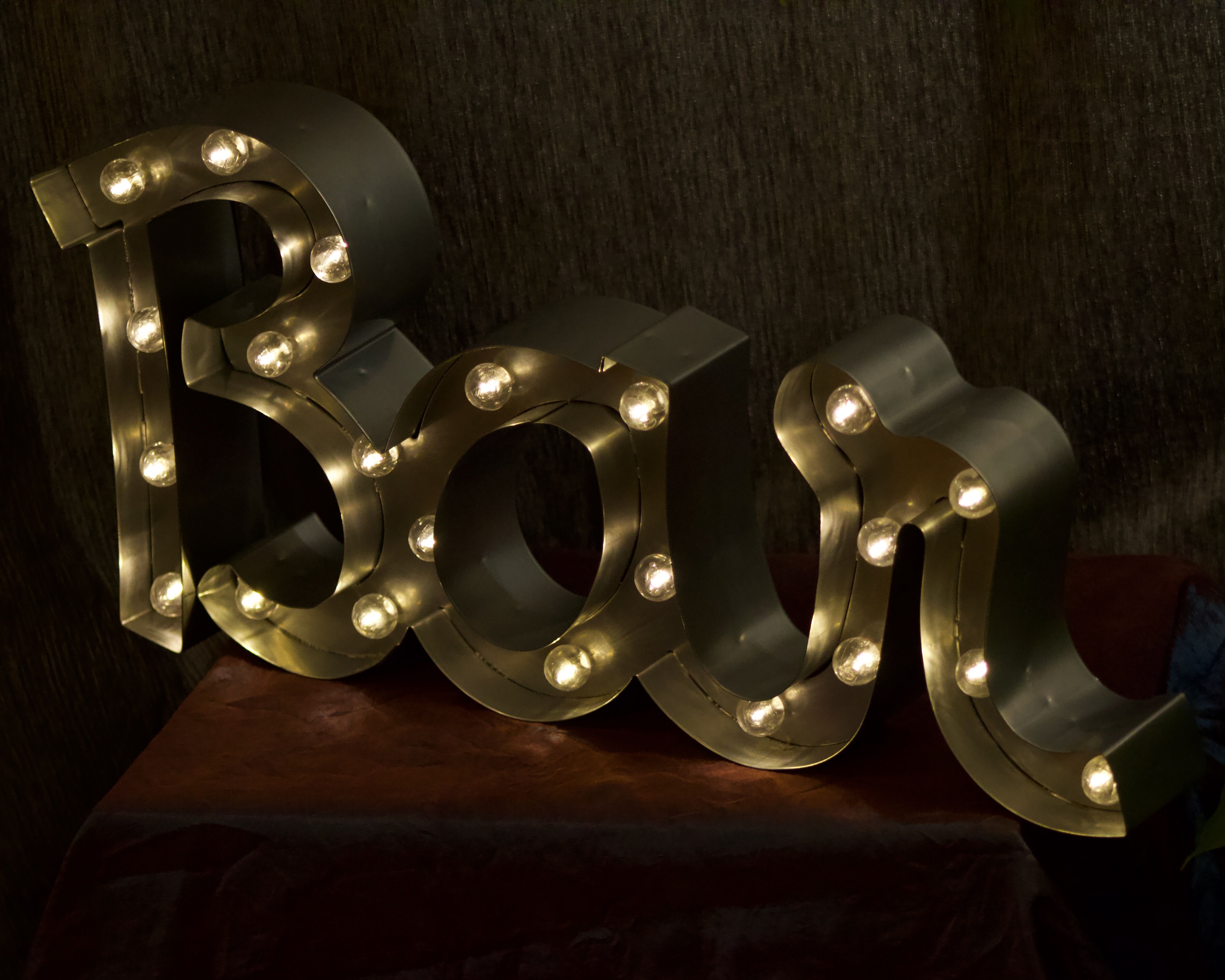 Ancient Light Sign in aluminium lettering forming the word "BAR"