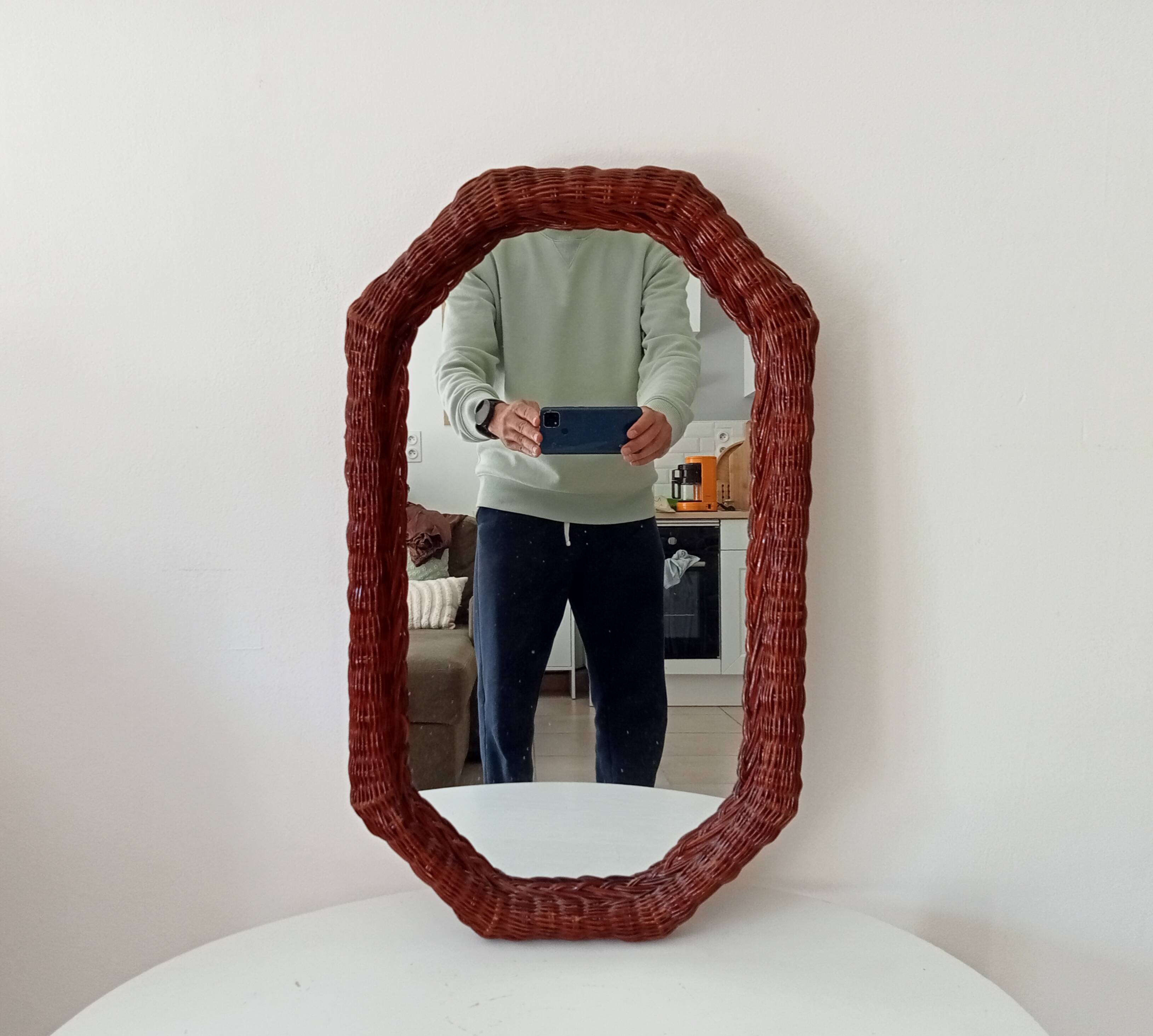 Vintage octagonal mirror in woven rattan.