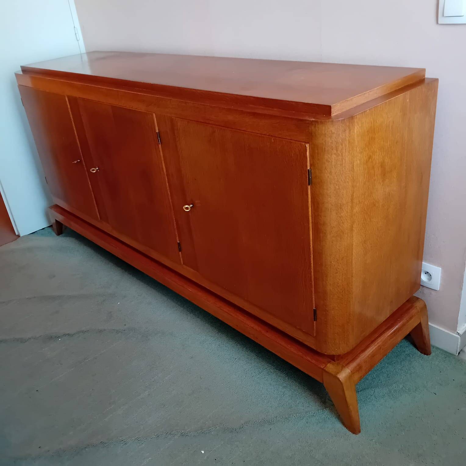 Large vintage sideboard with compass legs.