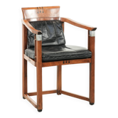 Chaise bureau en cuir noir au design Art Déco avec accoudoirs.