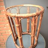 Round table in rattan and glass