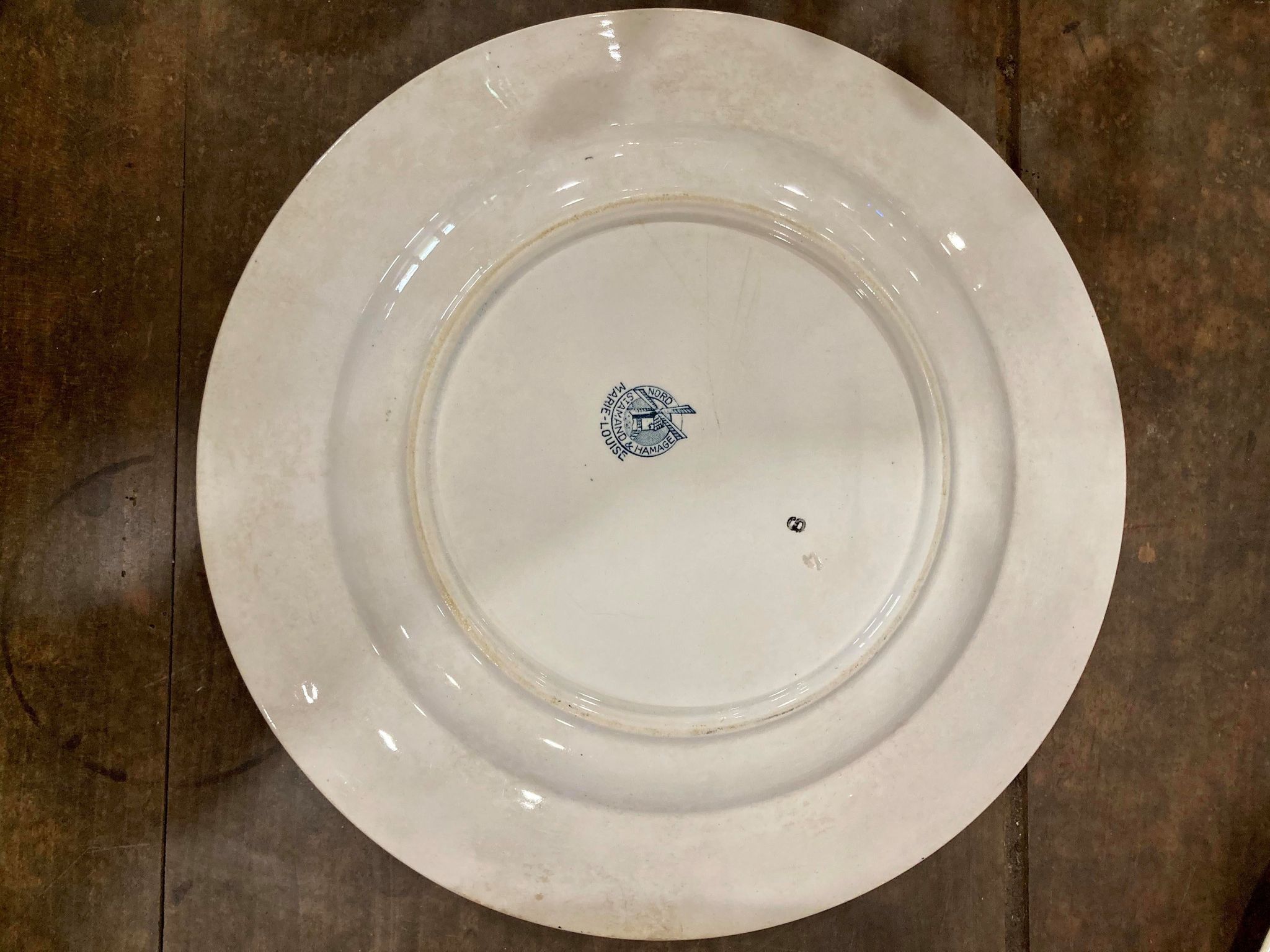 Round dish in Terre de Fer Saint-Amand and Hamage model Marie-Louise