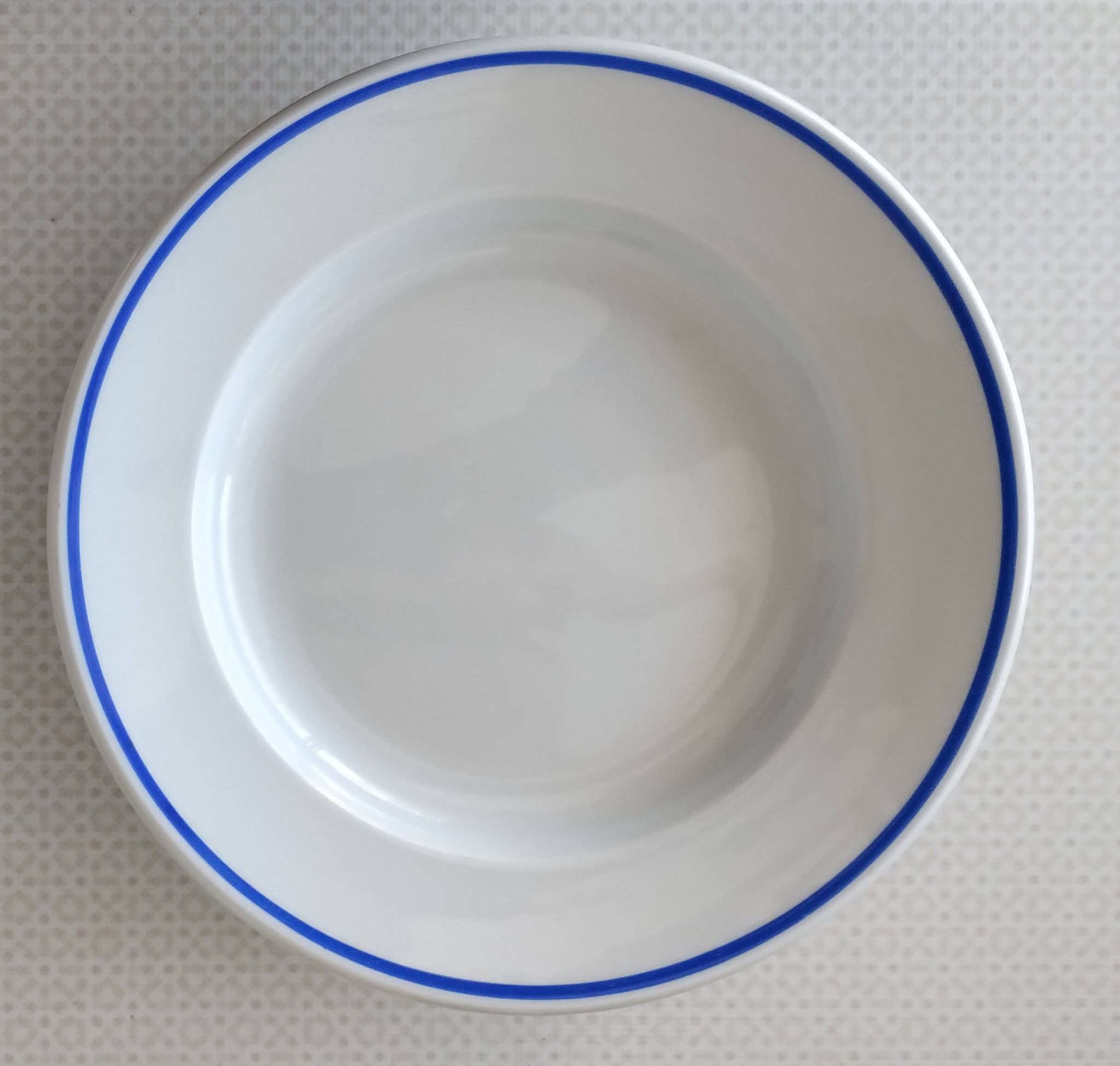 3 Pillivuyt white porcelain dinner plates with blue edging.