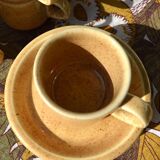 Series of 6 sandstone cups and saucers