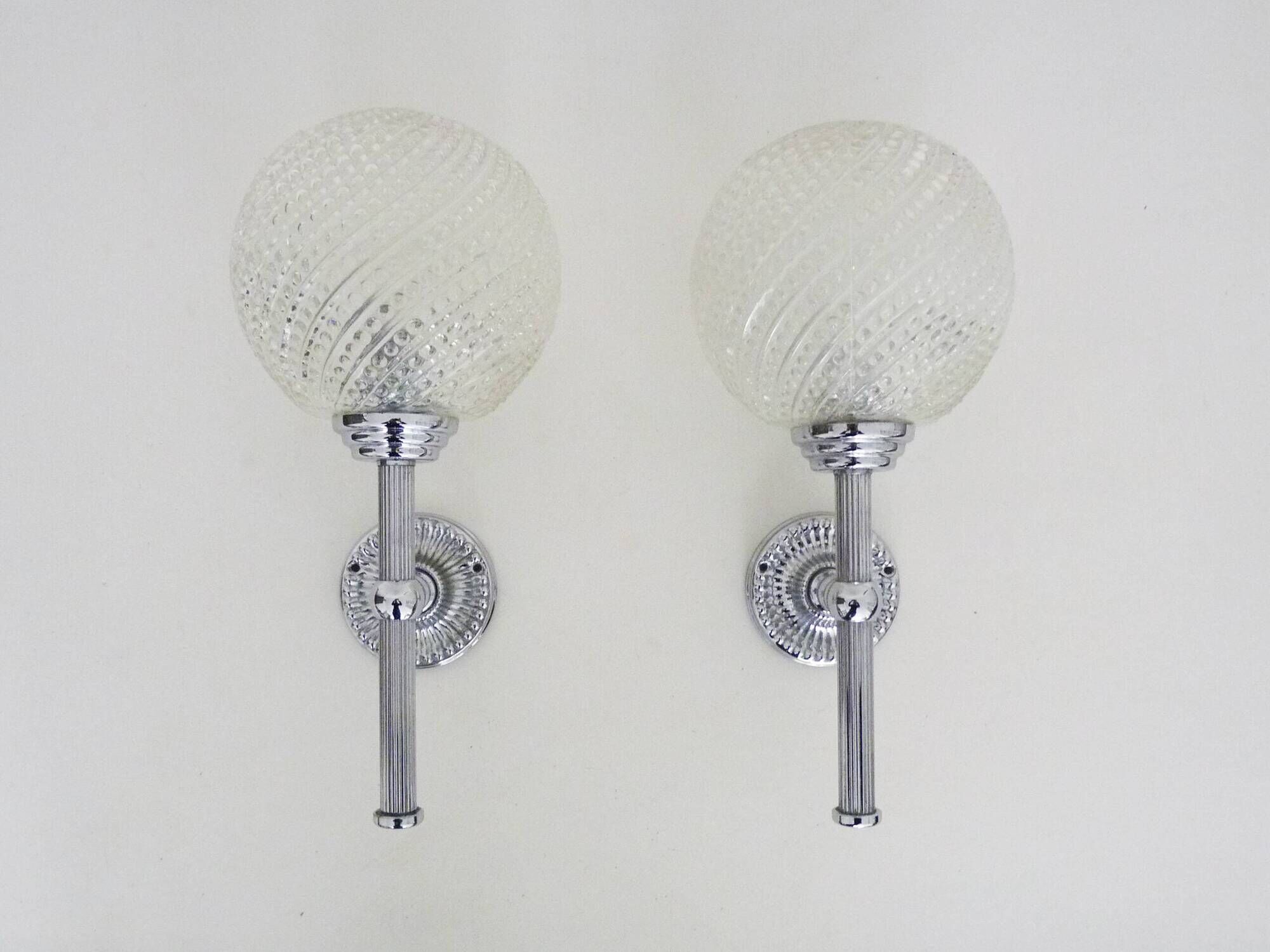 Pair of vintage Karl Lenz wall sconces. Chrome-plated metal and glass