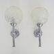 Pair of vintage Karl Lenz wall sconces. Chrome-plated metal and glass