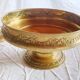 Fruit bowl, basket on foot, compote dish in embossed brass.