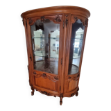Silver display cabinet with a curved design.