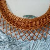 Old vintage sun mirror in rattan braid 60 years
