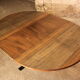 Extendable round table with steel base and wooden top