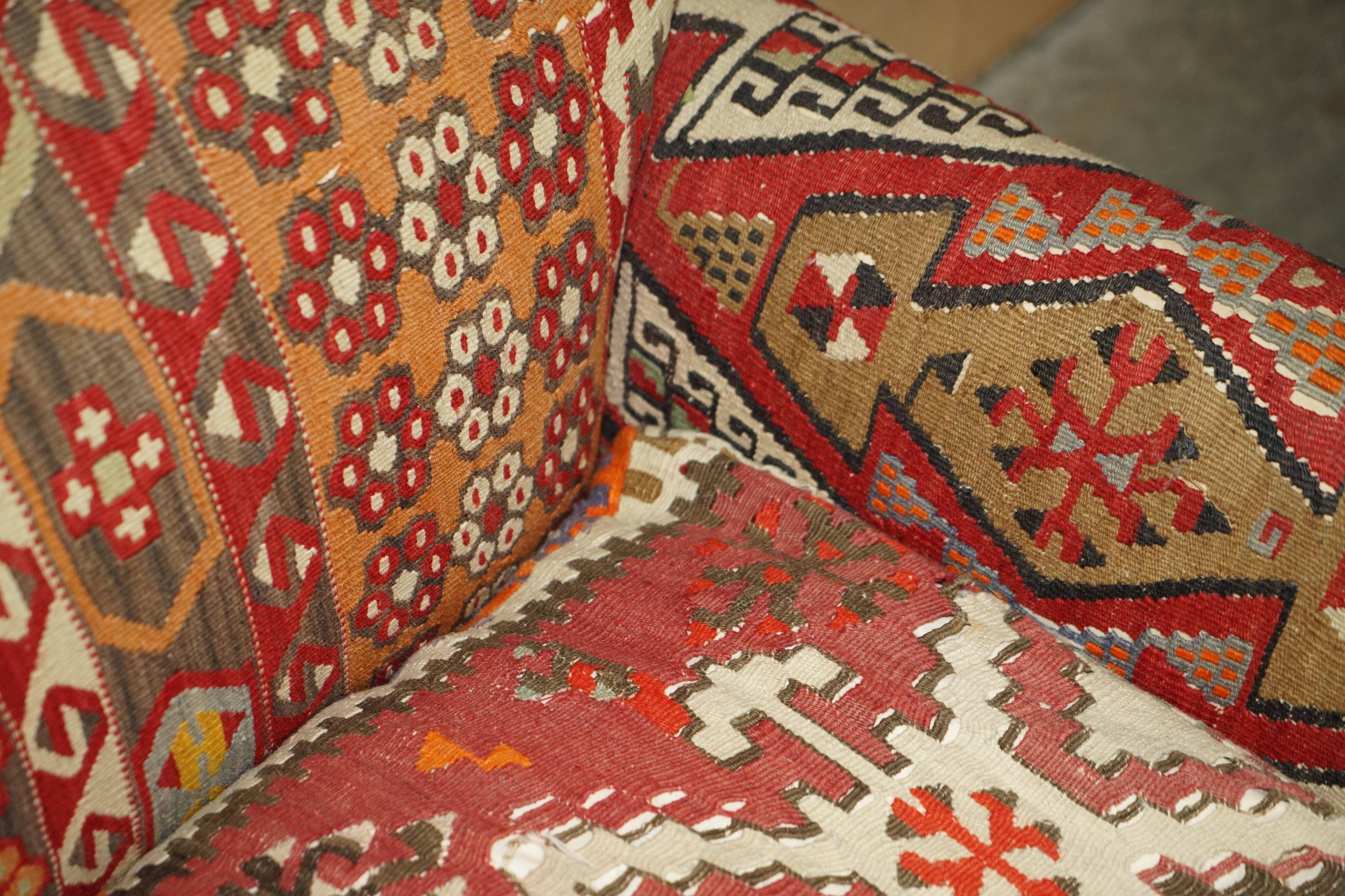Vintage three-seater canapé by George Smith upholstered in Kilim with feather cushions.
