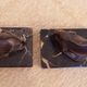 Art Deco pair of bookends with stylised fish in patinated metal and marble.