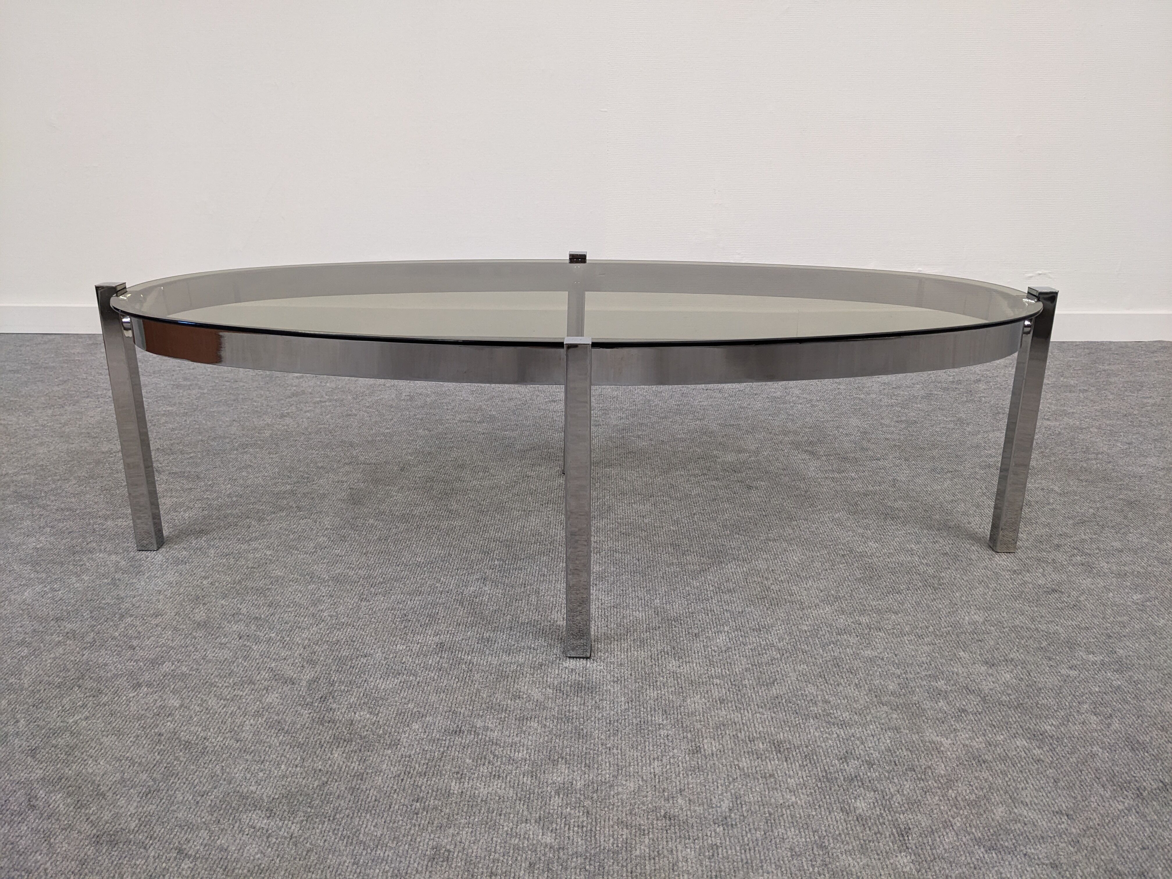 Oval smoked glass coffee table from the 60s/70s