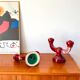 pair of burgundy enameled ceramic candlesticks / candelabras signed 1949