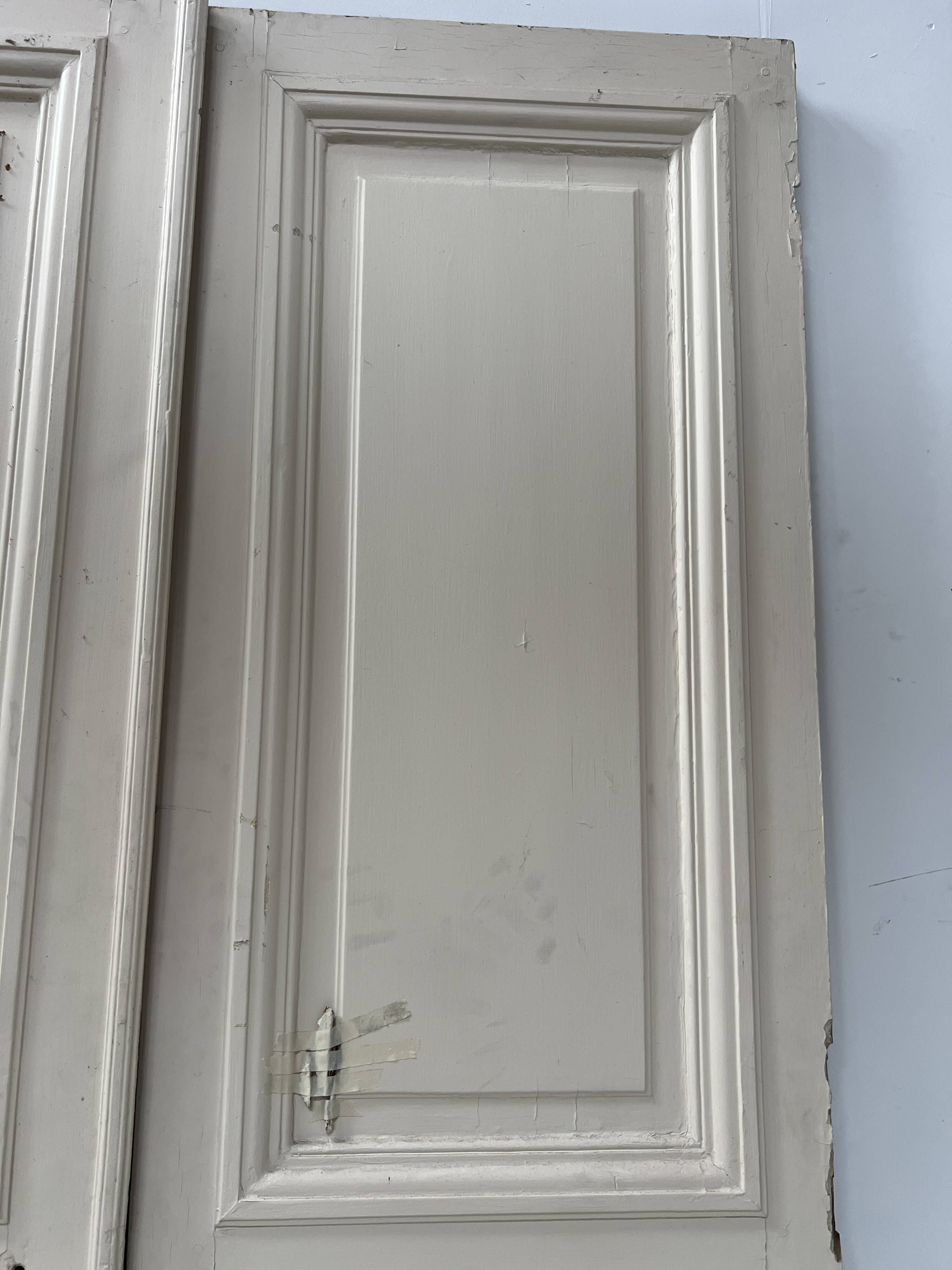 Pair of Haussmann-style double passage doors in patinated oak from the 19th century.