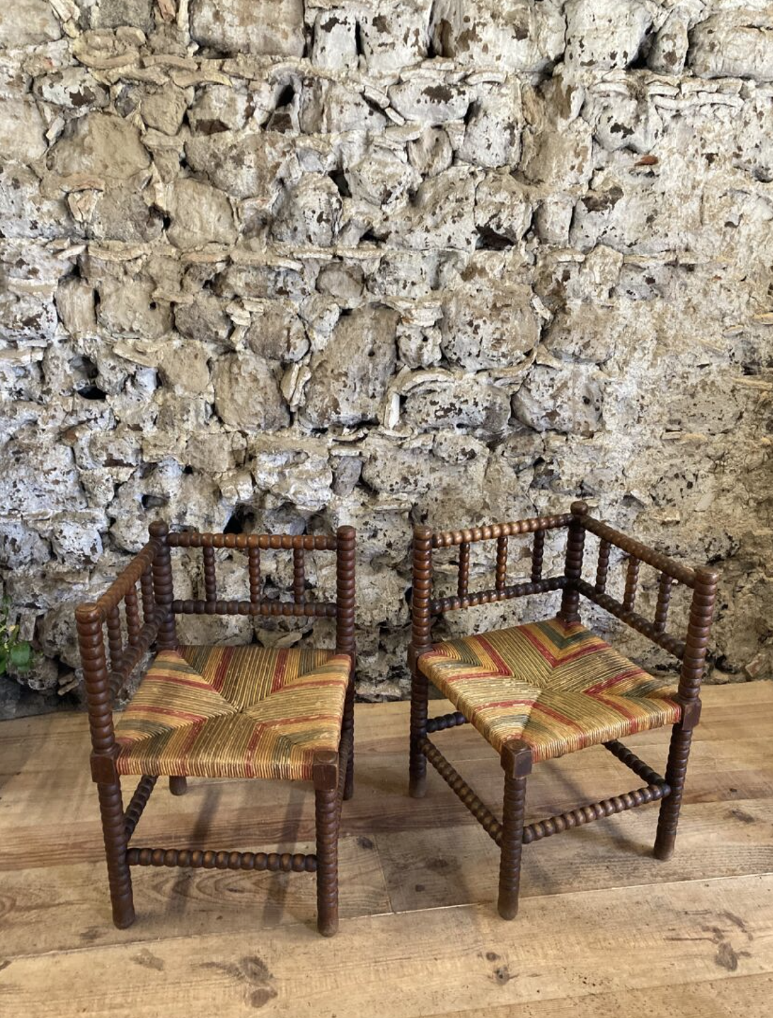 Pair of corner armchairs paillés in turned wood antique multicolored seat