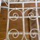 Small renovated wrought iron bed
