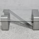 Coffee table with "kinetic" steel base and glass slab. Circa 1970.