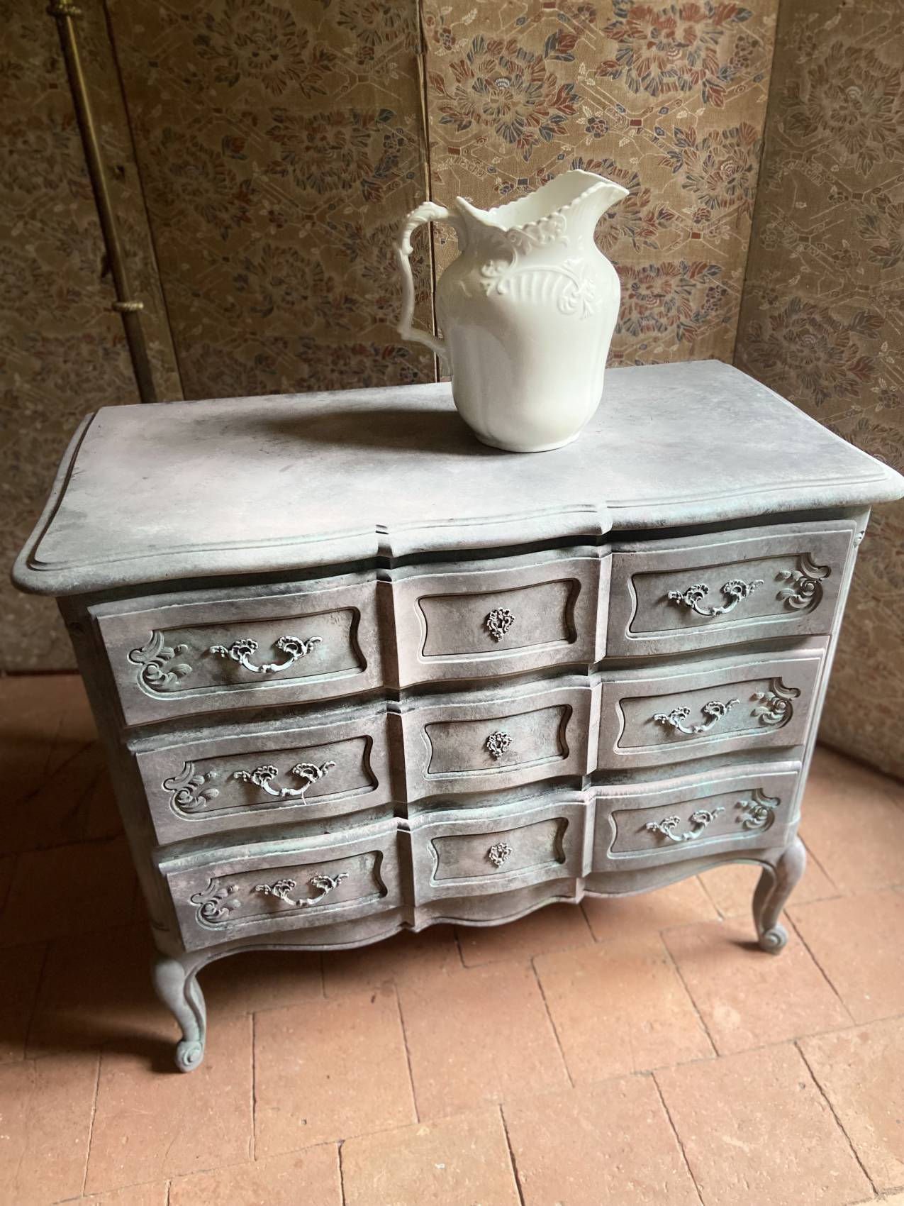 Antique Louis XV style commode, aged finish, practical elegance.