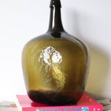 Dame jeanne ancienne en verre martelé